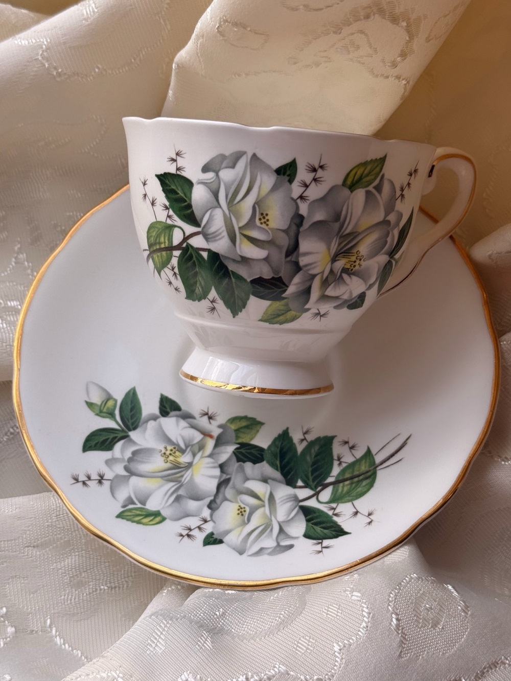 White Floral Teacup & Saucer with Gold Trim
